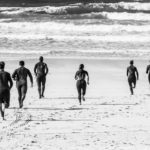 Groomsmen surfing St Ives